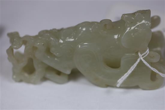 A Chinese archaistic white jade rhyton and a spinach green jade vase, 18th/19th century, H. 11cm and 8.5cm